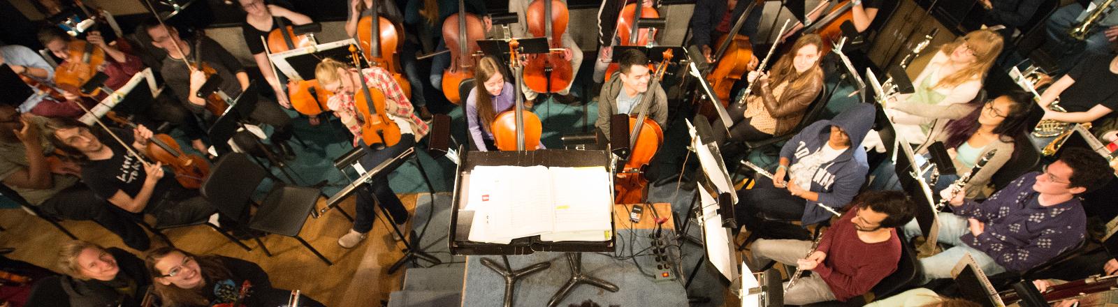 The Loyola School of Music Symphony Orchestra rehearses in the pit of Roussel Hall.