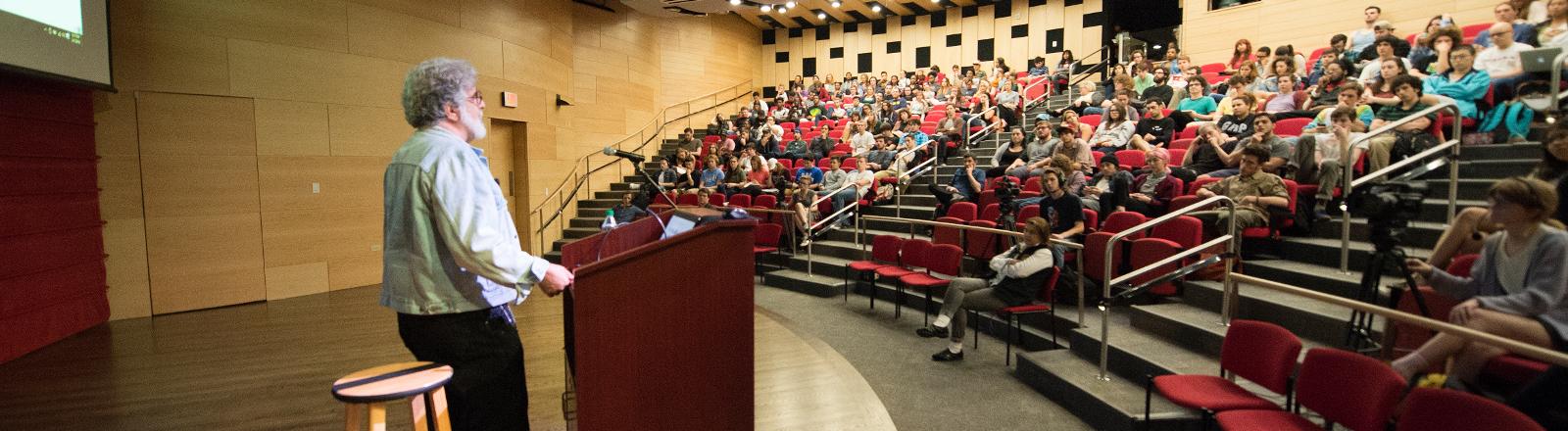 Loyola professor giving a lecture to students in Nunemaker hall