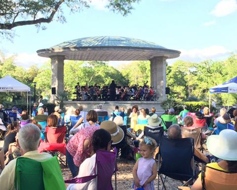 Loyola orchestra performing at Music Under the Oaks