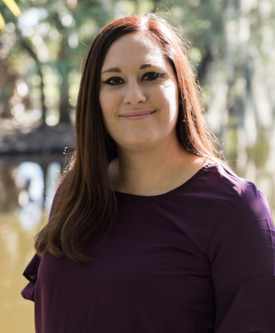 woman, long brown hair, trees background