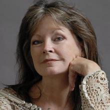 Patti Adams with hand on her face