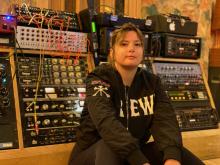 woman, sound equipment, dark hoodie