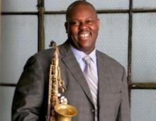 Wessell Anderson with a Saxophone